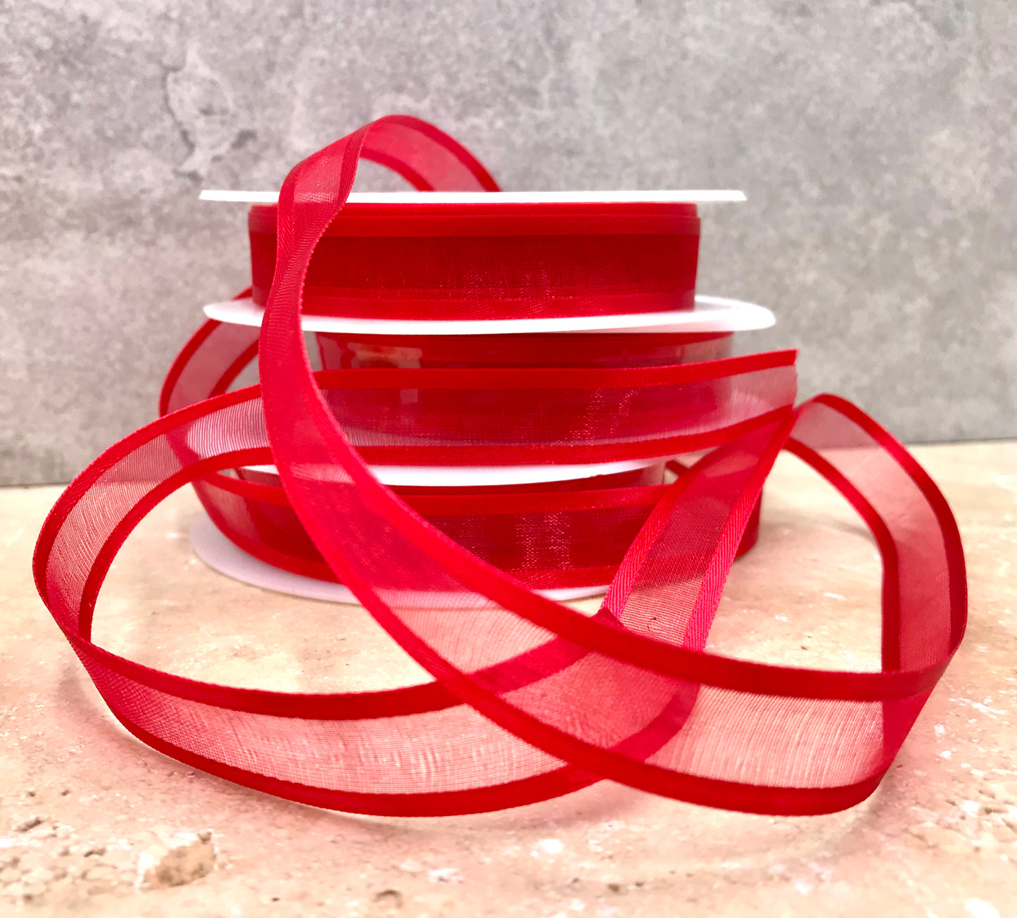 Lovely red sheer ribbon, beautifully enhances any gift